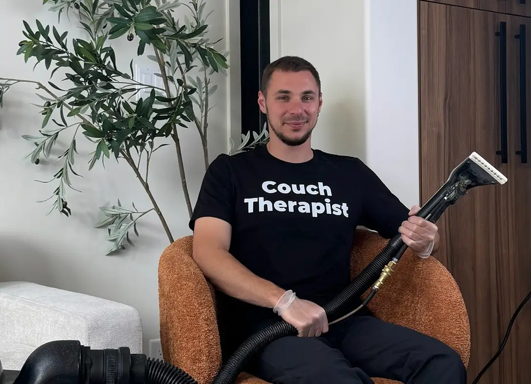 Professional upholstery cleaning technician from Charlotte Steamers ready to assist customers in Charlotte