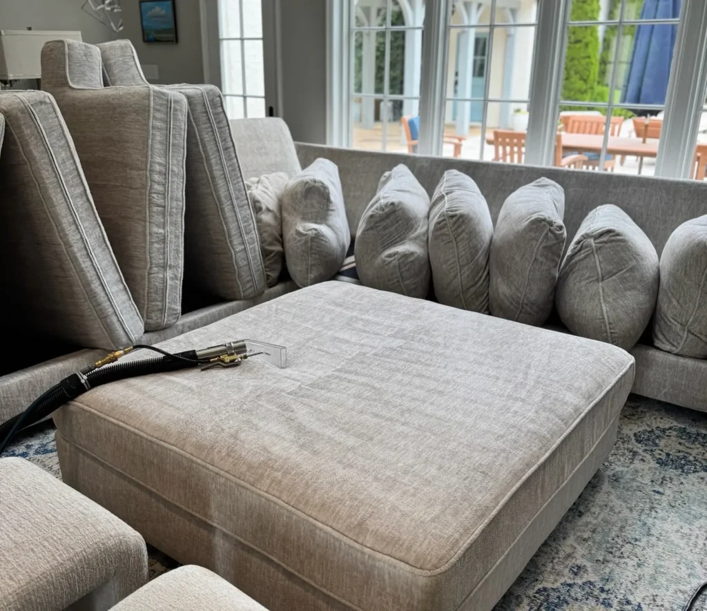 Sectional couch cleaning in Dallas removing dirt, stains, and pet hair from fabric sofa