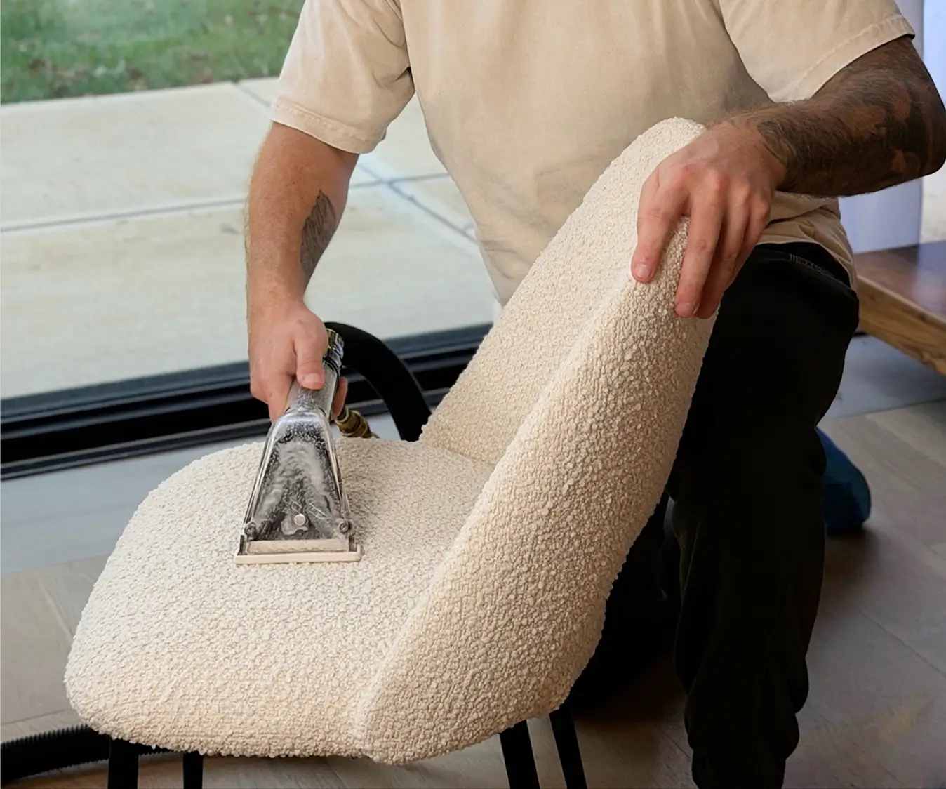 Professional upholstery cleaning in Dallas removing deep dirt and stains from fabric chair
