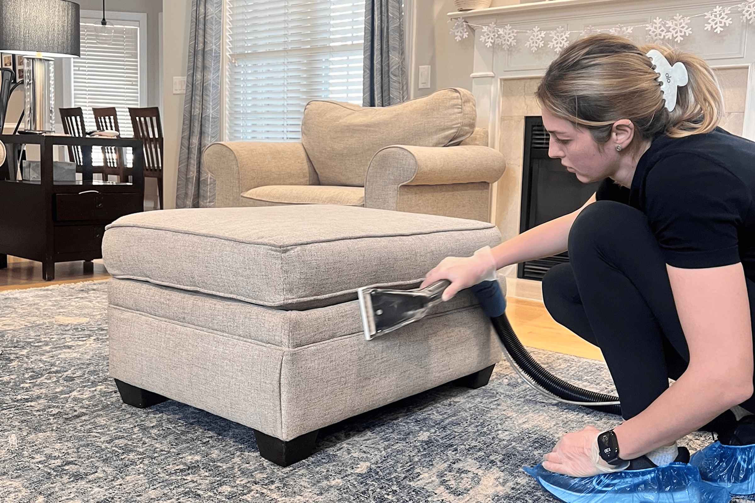 Steam upholstery cleaning service in Dallas, TX removing dirt from sofa fabric with professional couch cleaning equipment