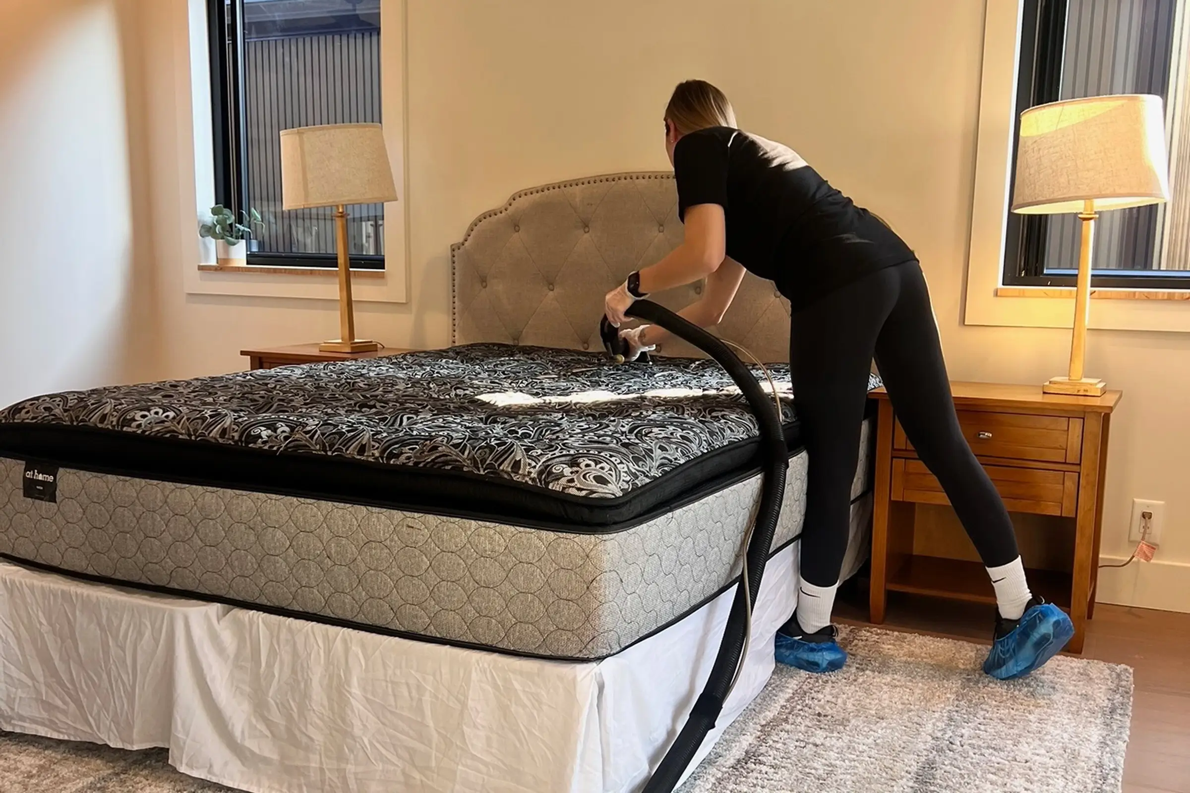 Texas Steamers technician performing professional upholstery cleaning service on a mattress in Dallas, TX using steam cleaning equipment