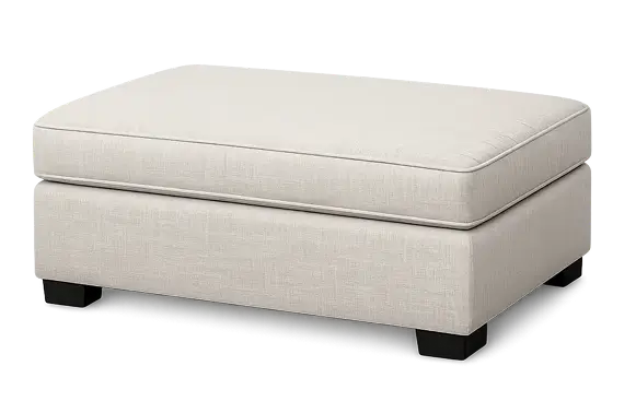 Beige upholstered rectangular ottoman for upholstery cleaning